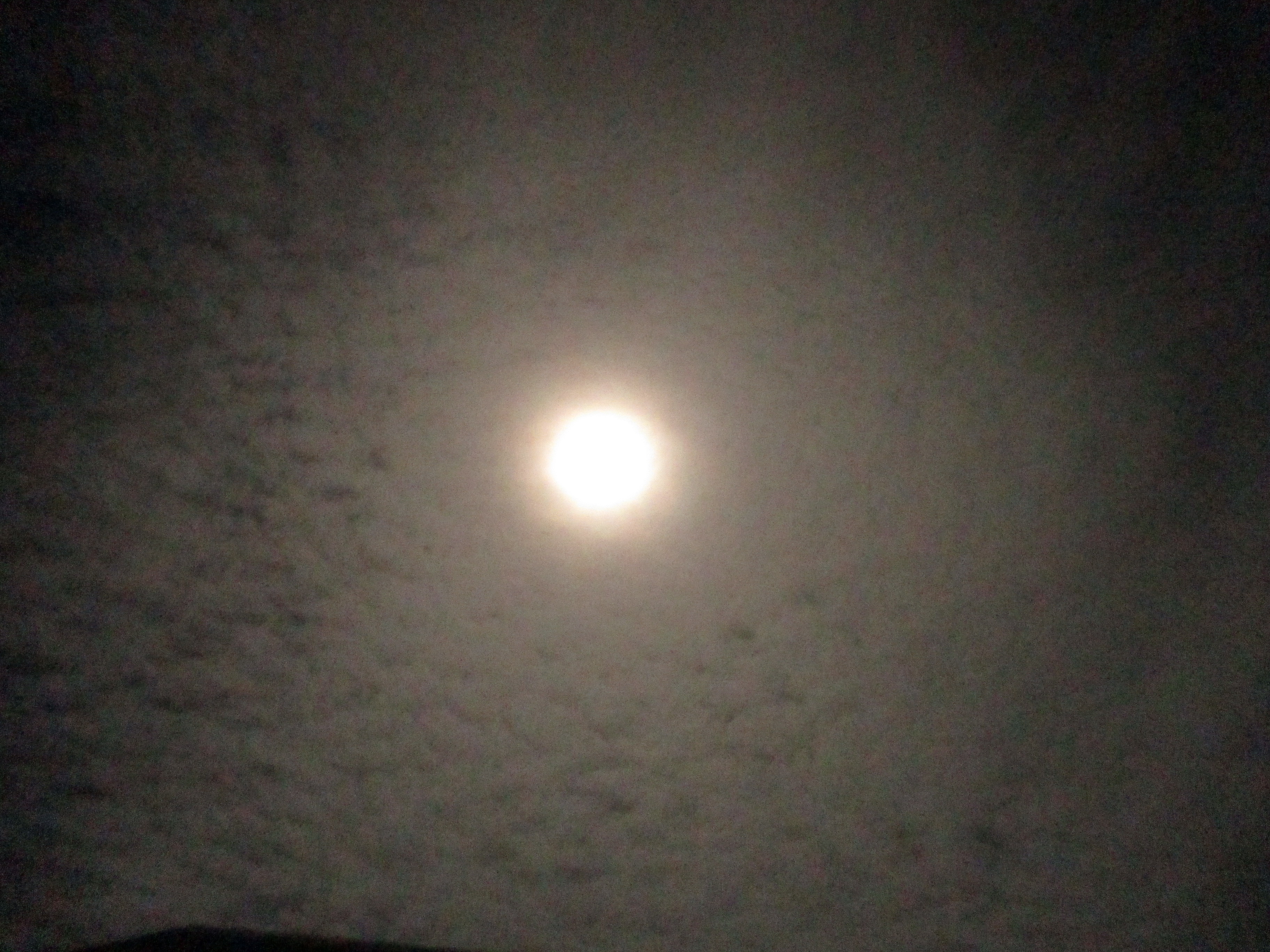 moon behind clouds